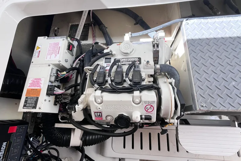 Slide: The Image of Engine compartment of 2020 Sea Ray Sundancer 320 Outboard with Westerbeke generator. - 84