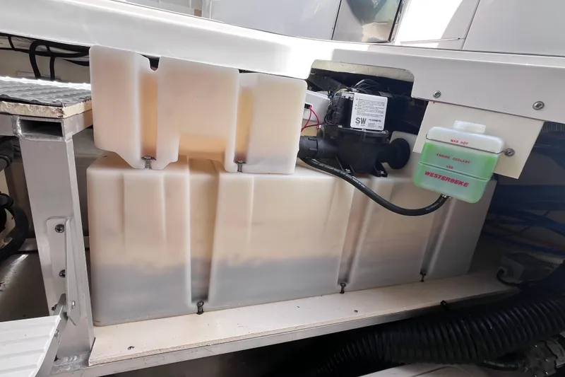 Slide: The Image of 2020 Sea Ray Sundancer 320 Outboard engine compartment with coolant system and storage tanks. - 88