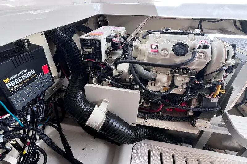 Slide: The Image of Engine compartment of 2020 Sea Ray Sundancer 320 Outboard with Minn Kota Precision charger. - 89