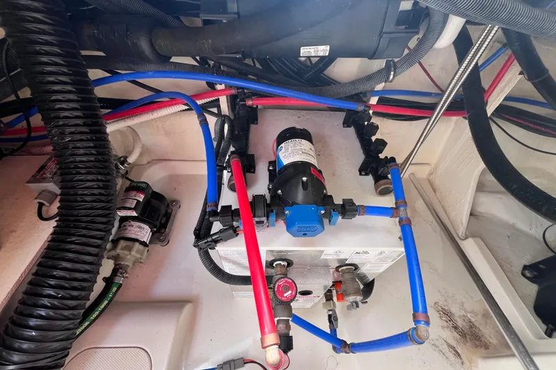 Slide: The Image of Engine compartment of 2020 Sea Ray Sundancer 320 Outboard with visible wiring and components. - 91