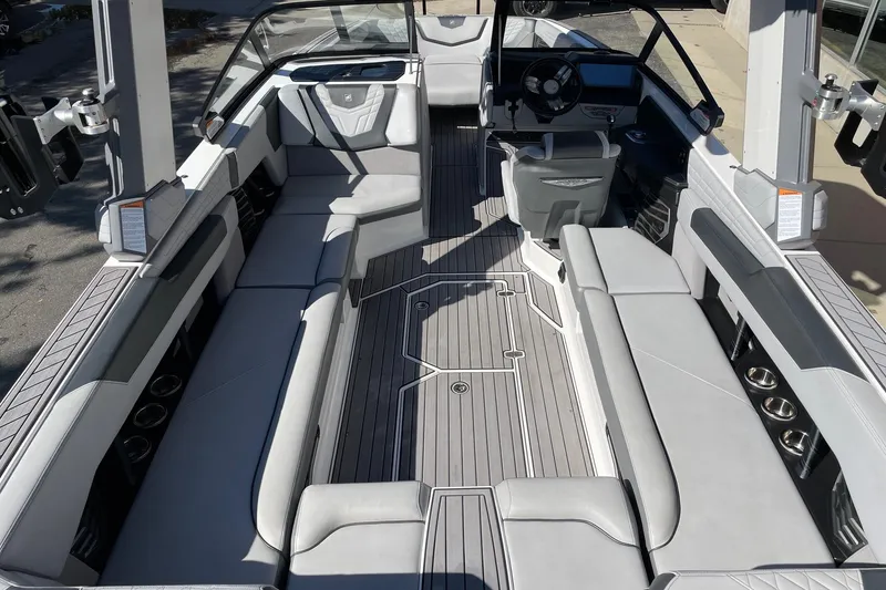 Slide: The Image of 2022 Nautique Super Air Nautique G25 interior with spacious seating and modern design. - 5