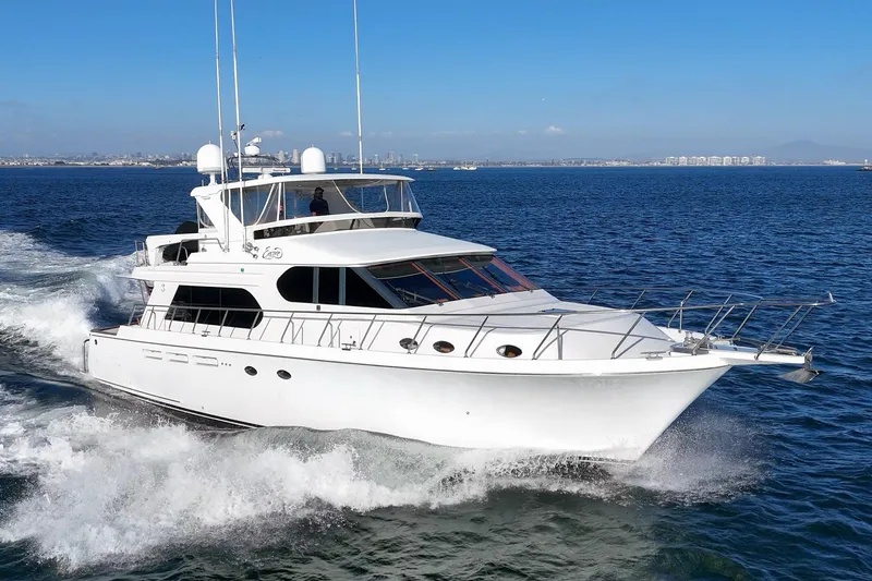 Slide: The Image of 2006 Ocean Alexander 64 Pilothouse yacht cruising on open water. - 1