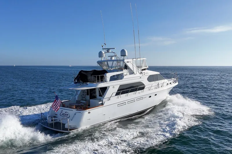 Slide: The Image of 2006 Ocean Alexander 64 Pilothouse yacht cruising on open sea. - 13