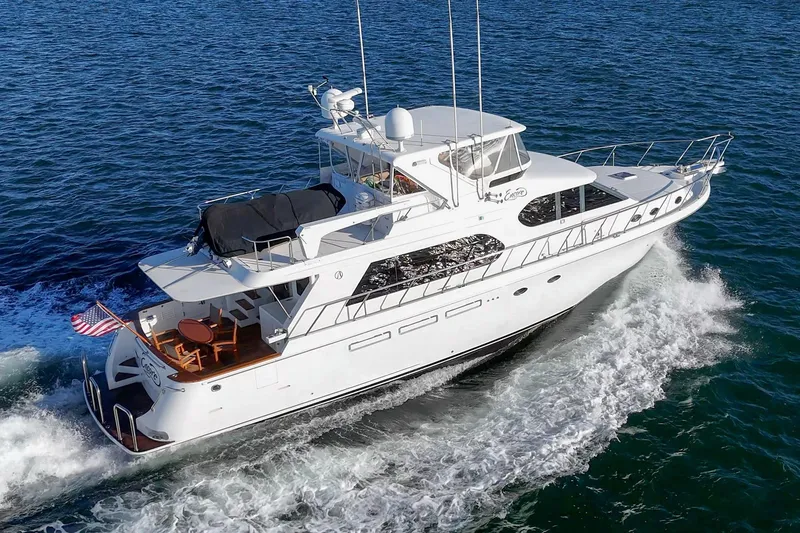 Slide: The Image of 2006 Ocean Alexander 64 Pilothouse yacht cruising on open water. - 14