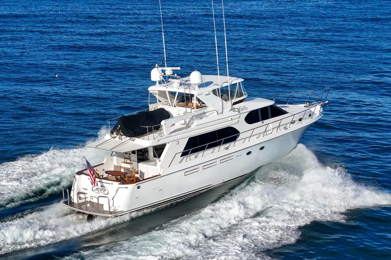 Slide: The Image of 2006 Ocean Alexander 64 Pilothouse yacht cruising on open water. - 15