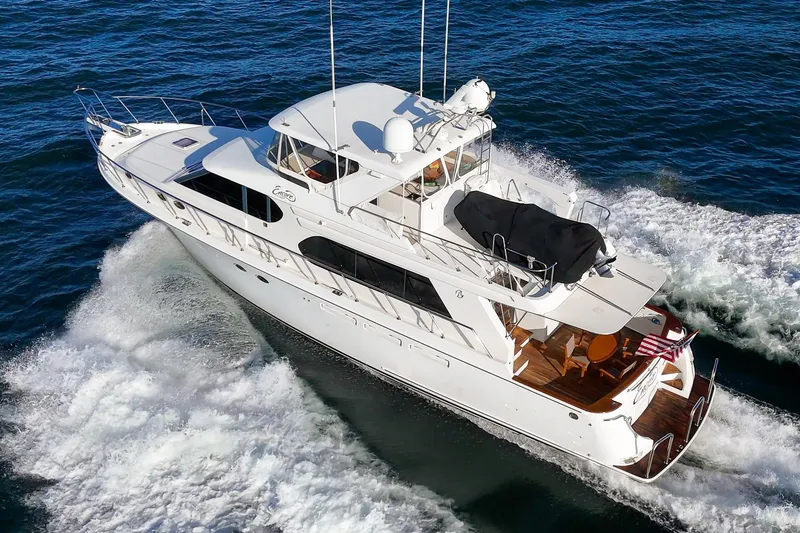 Slide: The Image of 2006 Ocean Alexander 64 Pilothouse yacht cruising on open water. - 18