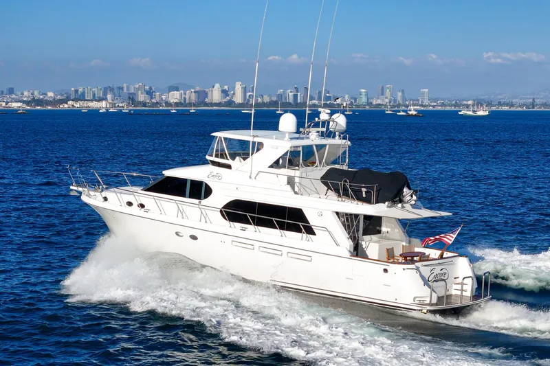 Slide: The Image of 2006 Ocean Alexander 64 Pilothouse yacht cruising near city skyline. - 19