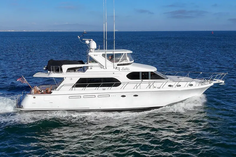 Slide: The Image of 2006 Ocean Alexander 64 Pilothouse yacht cruising on open water. - 2