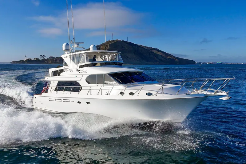 Slide: The Image of 2006 Ocean Alexander 64 Pilothouse yacht cruising on open water. - 21