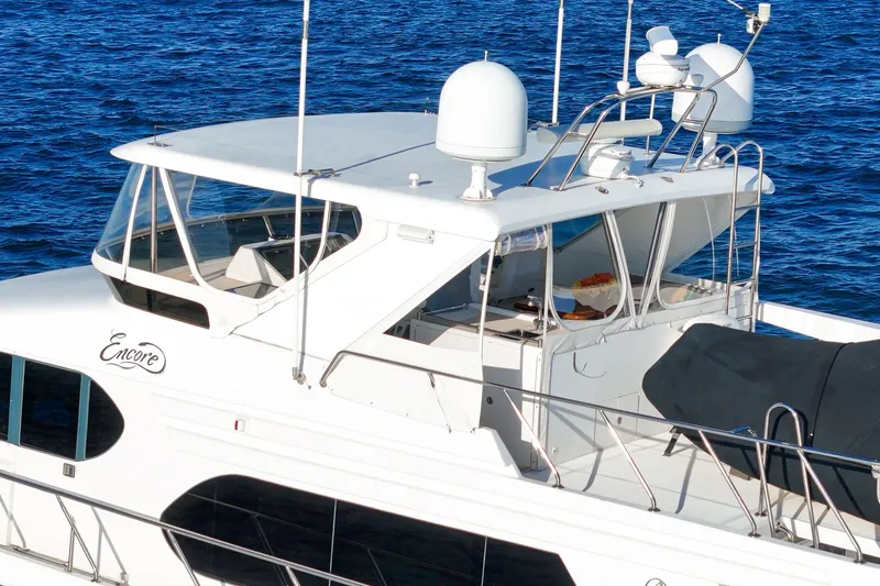 Slide: The Image of 2006 Ocean Alexander 64 Pilothouse yacht on blue water, featuring sleek design and modern amenities. - 25