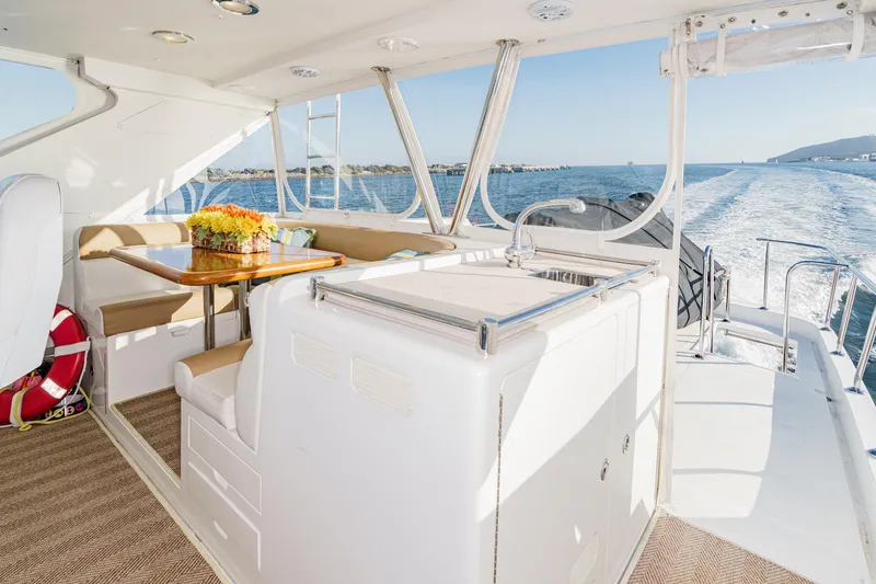 Slide: The Image of Luxurious 2006 Ocean Alexander 64 Pilothouse yacht interior with dining area and ocean view. - 27