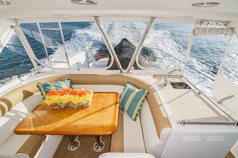 Slide: The Image of Luxurious 2006 Ocean Alexander 64 Pilothouse interior with elegant seating and ocean view. - 28