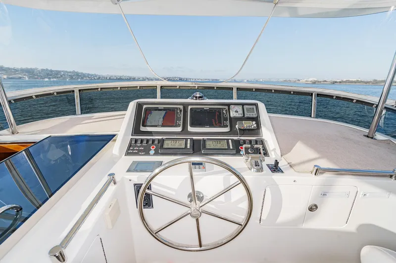 Slide: The Image of Pilothouse of 2006 Ocean Alexander 64, featuring navigation controls and ocean view. - 32