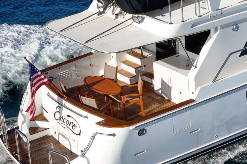 Slide: The Image of Luxury 2006 Ocean Alexander 64 Pilothouse yacht with elegant deck and American flag. - 35