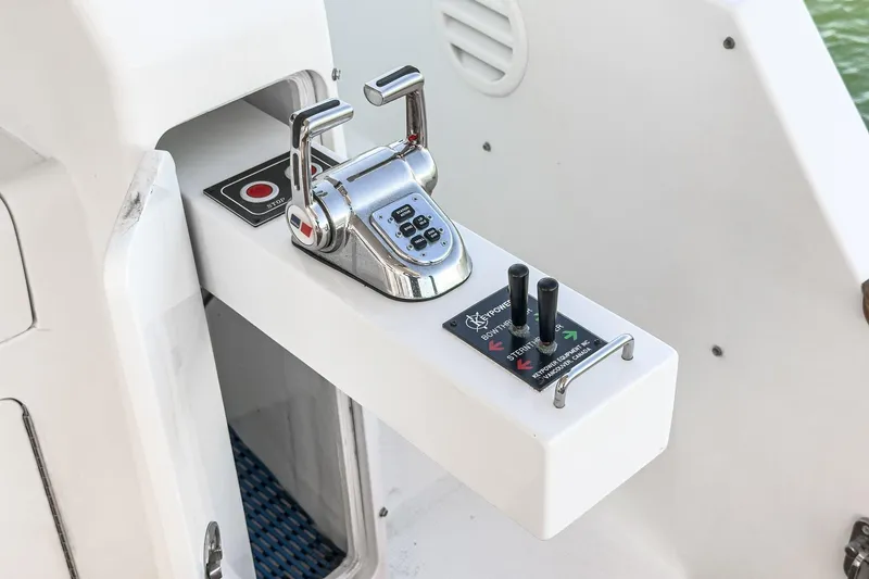 Slide: The Image of Control panel of a 2006 Ocean Alexander 64 Pilothouse yacht, featuring throttle and joystick. - 39