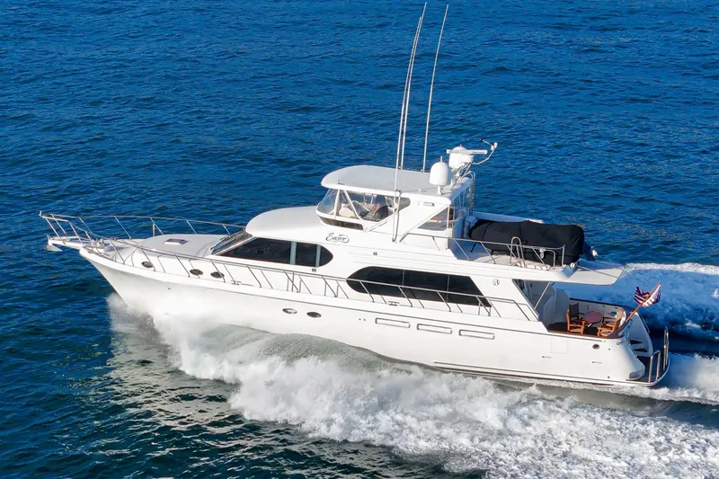 Slide: The Image of 2006 Ocean Alexander 64 Pilothouse yacht cruising on open water. - 4