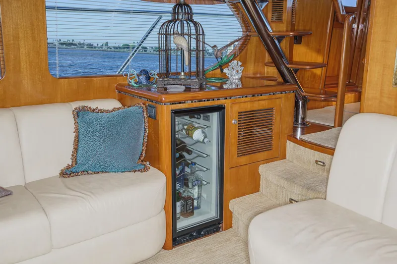 Slide: The Image of Luxurious interior of 2006 Ocean Alexander 64 Pilothouse yacht with mini fridge and seating. - 45