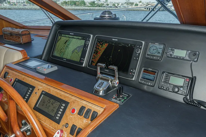 Slide: The Image of Pilothouse of 2006 Ocean Alexander 64, featuring navigation and communication equipment. - 50