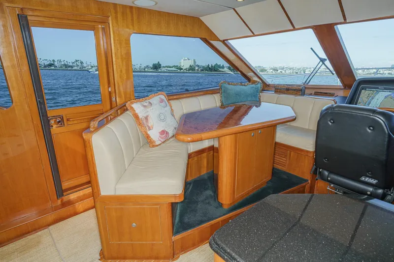 Slide: The Image of Luxurious interior of 2006 Ocean Alexander 64 Pilothouse yacht with elegant seating and ocean view. - 51