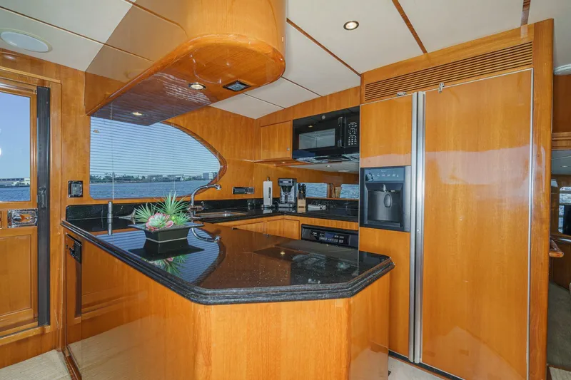 Slide: The Image of Luxurious kitchen interior of 2006 Ocean Alexander 64 Pilothouse yacht with modern appliances. - 52