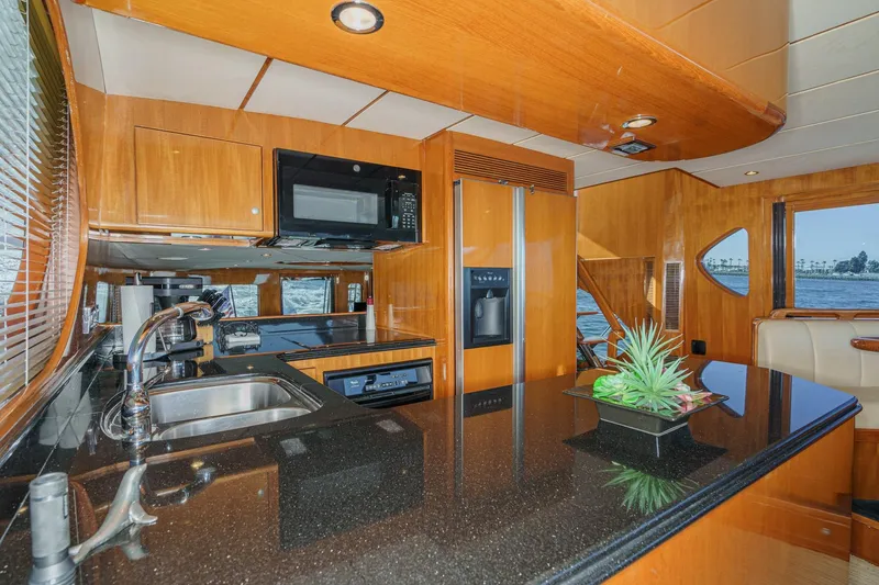 Slide: The Image of Luxurious kitchen interior of 2006 Ocean Alexander 64 Pilothouse yacht with modern amenities. - 54