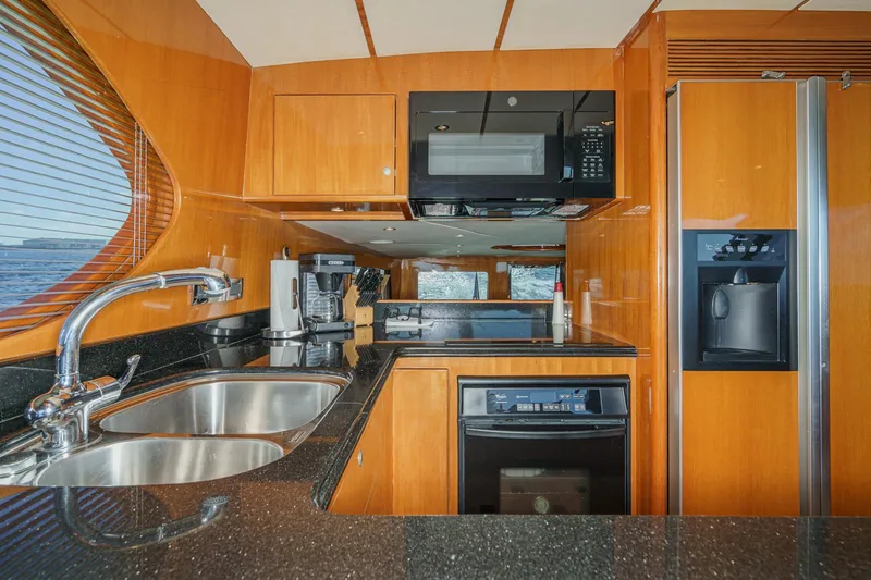 Slide: The Image of Luxurious kitchen interior of 2006 Ocean Alexander 64 Pilothouse yacht with modern appliances. - 55