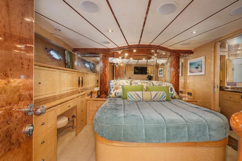 Slide: The Image of Luxurious bedroom interior of 2006 Ocean Alexander 64 Pilothouse yacht with elegant wood finishes. - 56