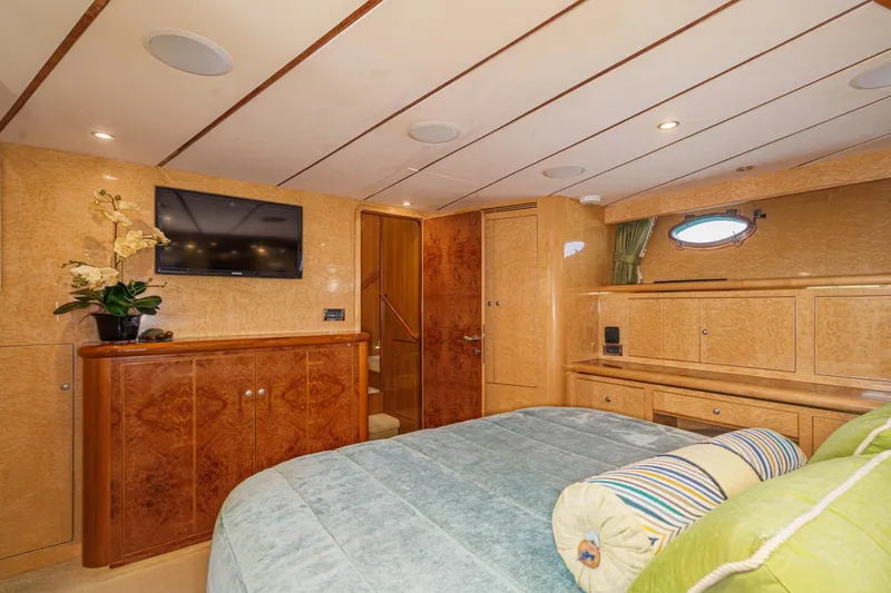 Slide: The Image of Luxurious 2006 Ocean Alexander 64 Pilothouse bedroom with elegant wood finishes and modern amenities. - 57