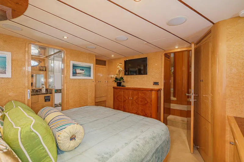 Slide: The Image of Luxurious bedroom interior of 2006 Ocean Alexander 64 Pilothouse yacht with elegant wood finishes. - 58
