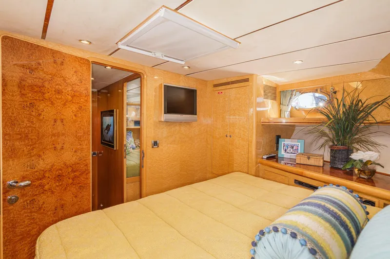 Slide: The Image of Luxurious 2006 Ocean Alexander 64 Pilothouse bedroom with elegant wood finish and modern amenities. - 62