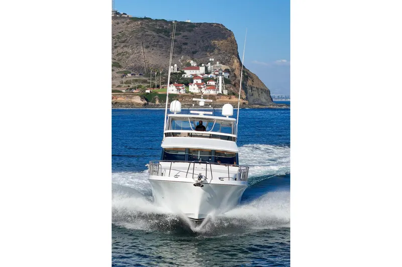 Slide: The Image of Ocean Alexander 64 Pilothouse yacht cruising near rocky coastline, 2006 model. - 7