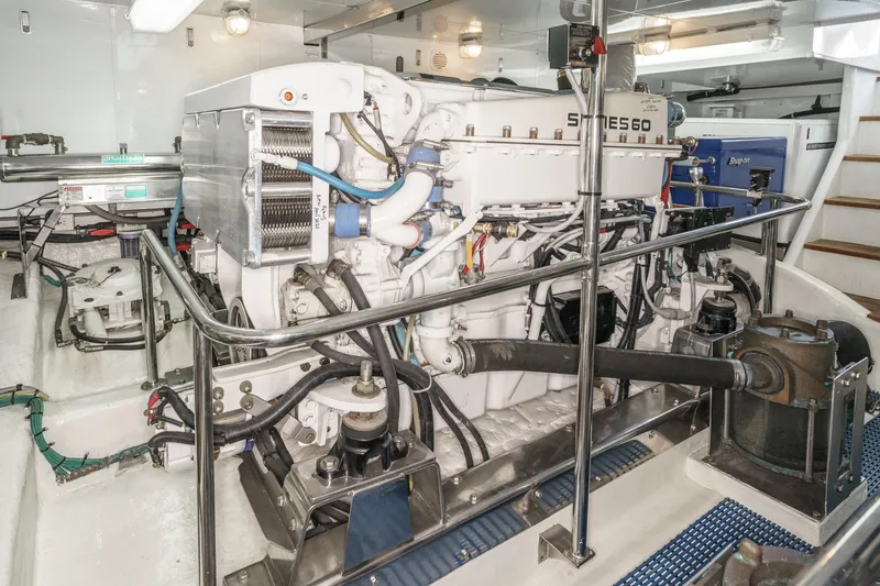 Slide: The Image of Engine room of 2006 Ocean Alexander 64 Pilothouse yacht, showcasing machinery and equipment. - 70