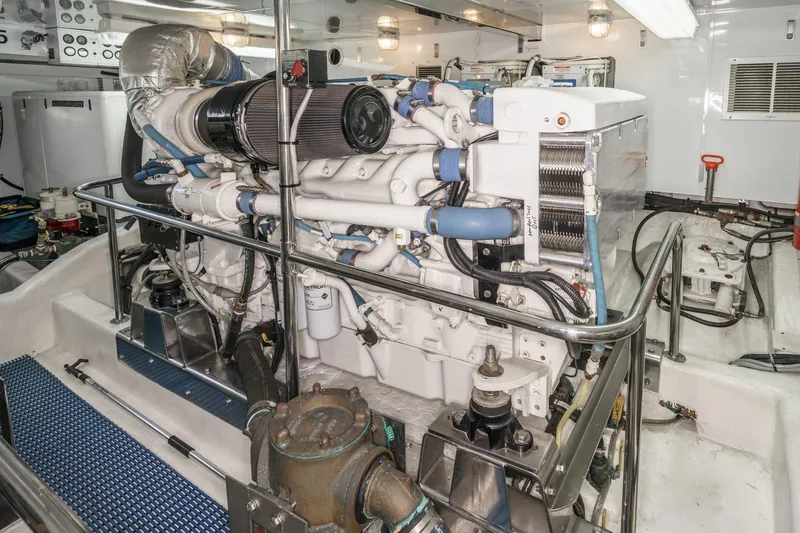 Slide: The Image of Engine room of 2006 Ocean Alexander 64 Pilothouse yacht, showcasing detailed machinery and components. - 72