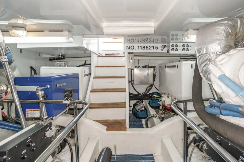 Slide: The Image of Engine room of 2006 Ocean Alexander 64 Pilothouse yacht, featuring equipment and storage. - 73