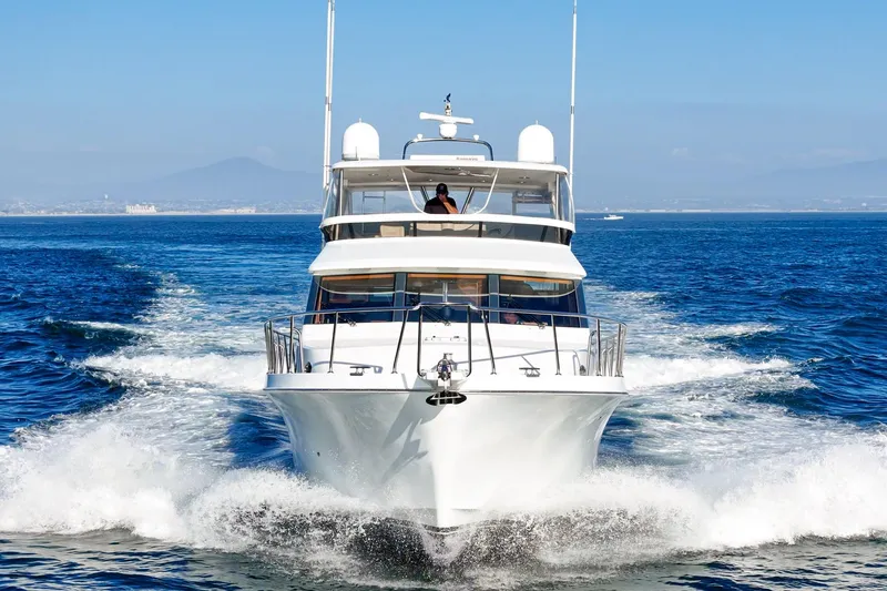 Slide: The Image of 2006 Ocean Alexander 64 Pilothouse yacht cruising on open sea. - 8