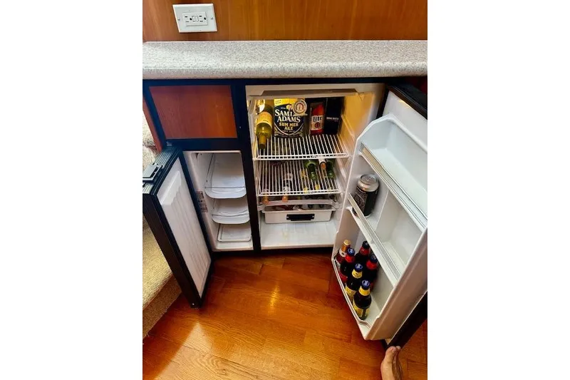 Slide: The Image of Mini fridge stocked with beverages on a 2001 Silverton 42 Convertible yacht. - 14