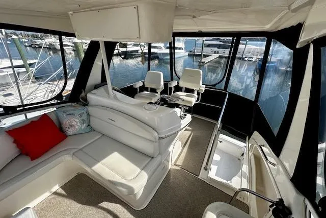 Slide: The Image of Interior view of 2001 Silverton 42 Convertible yacht with seating and helm. - 28