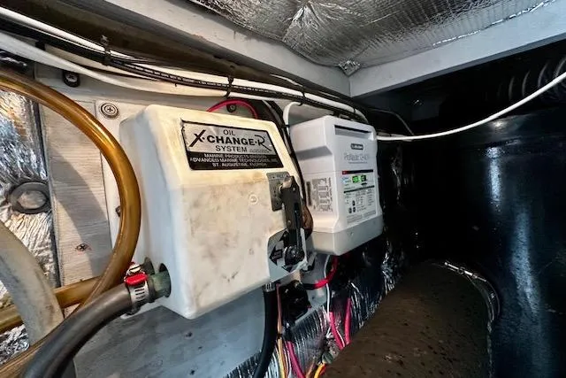 Slide: The Image of Engine room of 2001 Silverton 42 Convertible with oil changer system and wiring. - 32