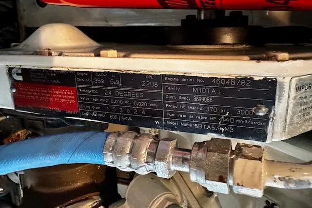 Slide: The Image of Engine label on a 2001 Silverton 42 Convertible, featuring Cummins specifications and serial details. - 33