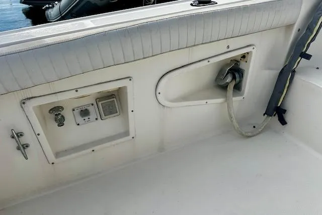 Slide: The Image of 2001 Silverton 42 Convertible boat deck with utility connections and power cable. - 34