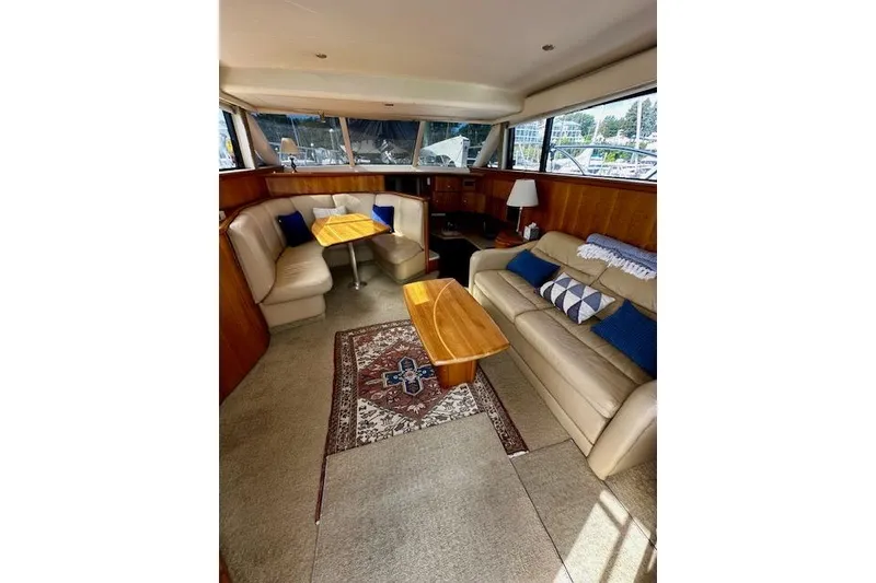 Slide: The Image of Luxurious interior of 2001 Silverton 42 Convertible yacht with plush seating and elegant decor. - 5