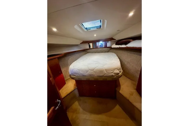 Slide: The Image of Interior cabin of 2001 Silverton 42 Convertible yacht with bed and skylight. - 6