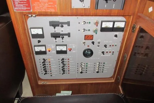 Slide: The Image of Electrical control panel on a 1988 Sea Ray 415 Aft Cabin boat. - 26