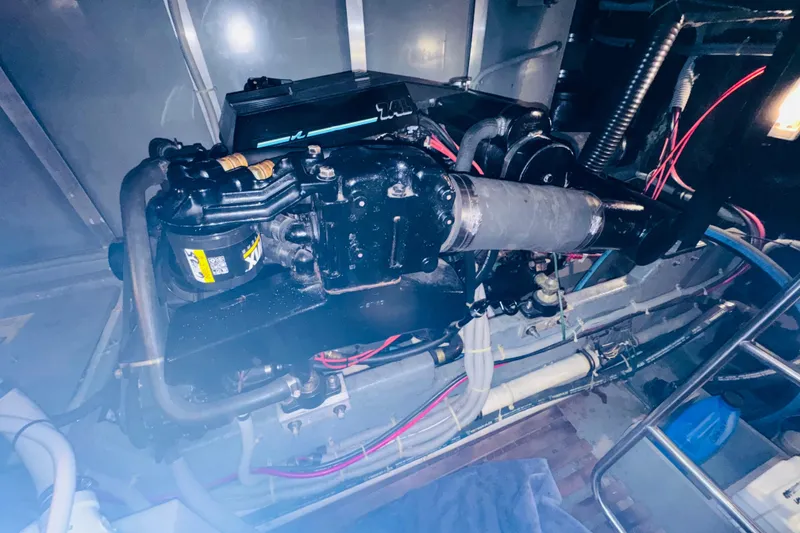 Slide: The Image of Engine room of 1988 Sea Ray 415 Aft Cabin with visible components and wiring. - 43