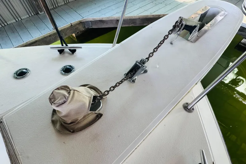 Slide: The Image of 1988 Sea Ray 415 Aft Cabin deck with anchor chain and hat. - 6