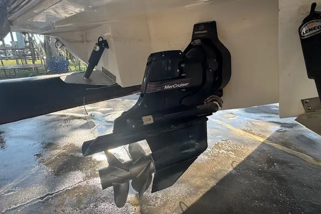 Slide: The Image of 2015 Cobalt 26SD boat with MerCruiser outdrive in a marina setting. - 10