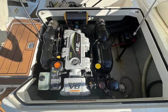 Slide: The Image of Engine compartment of a 2015 Cobalt 26SD boat, featuring a powerful V8 engine. - 23