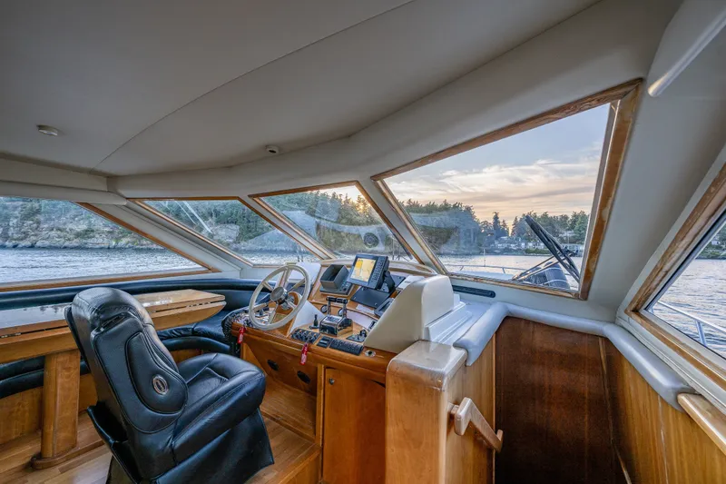 Slide: The Image of Pilothouse interior of 2001 Navigator 61' yacht with scenic water view. - 28