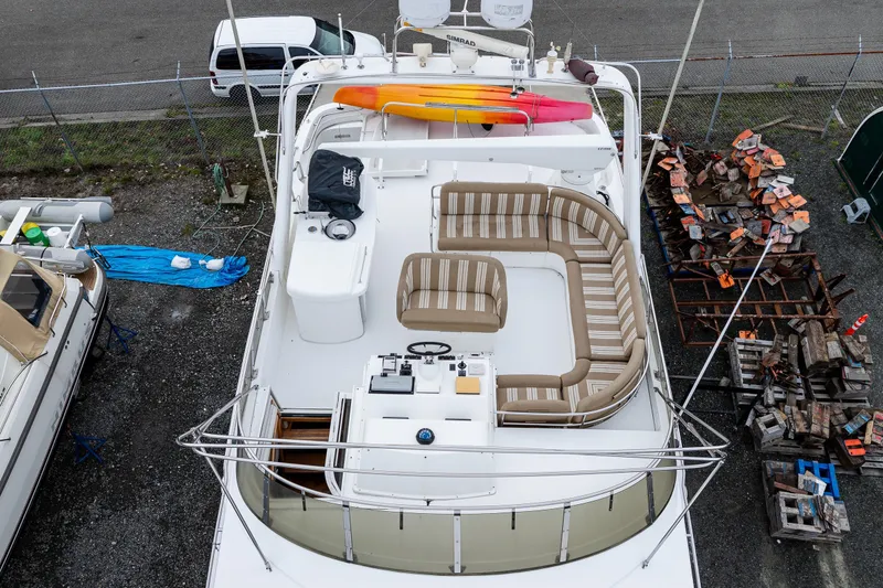 Slide: The Image of Aerial view of 2001 Navigator 61' Pilothouse yacht with spacious deck seating and kayaks. - 47