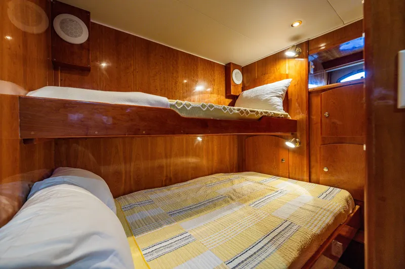 Slide: The Image of Cozy wooden cabin with bunk beds in 2001 Navigator 61' Pilothouse yacht. - 71